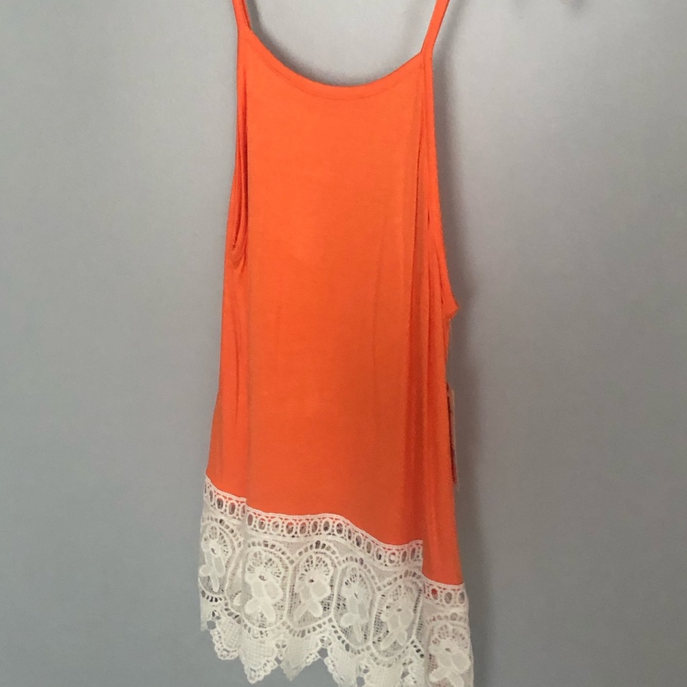 Women’s size small tank top. Melon color